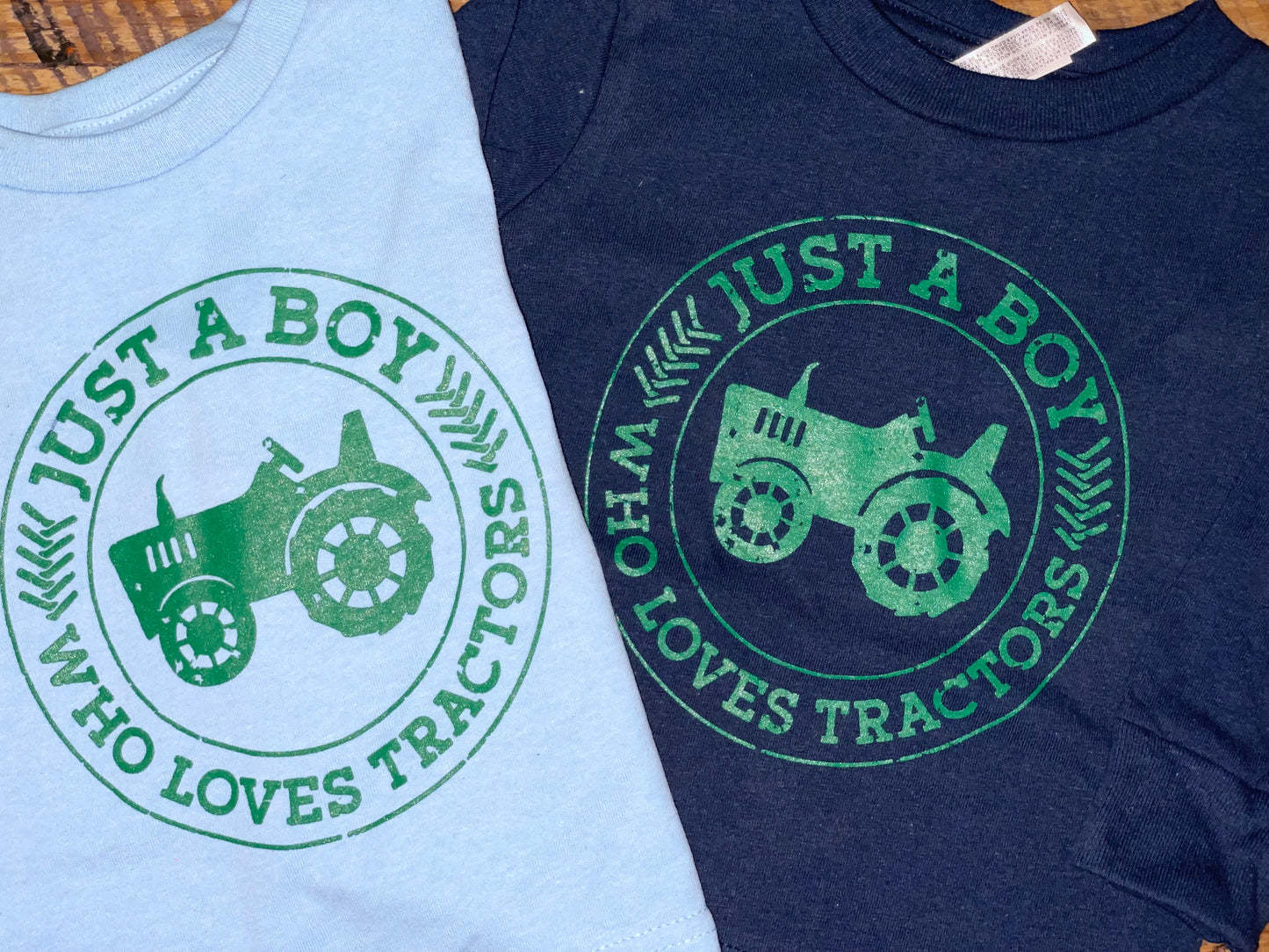 Just a boy who loves tractors screen print tee shirt for baby boys, toddler boys, and big kids, light blue and navy with green